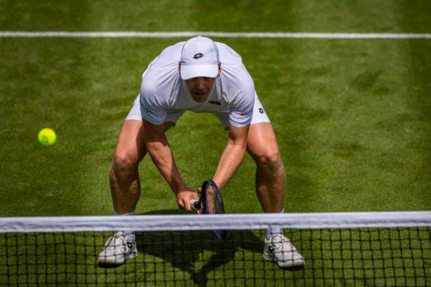 RECORD DATE NOT STATED 3rd July 2026; All England Lawn Tennis and Croquet Club, London, England; Wimbledon Tennis Tournament, Day Five; Harri Heliovaara (FIN) in action with Henry Patten (GBR) in their second round match against Mac Kiger (USA) and Patrik Trhac (USA) GodfreyxPitt