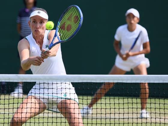 Belgian Elise Mertens and Chinese Tianhui Zhang pictured during a doubles tennis match against Romanian pair Cristian-Begu, in the first round of the Women s doubles at the Wimbledon grand slam tennis tournament in London, Britain, Friday 03 July 2026. BENOITxDOPPAGNE  x180254253x