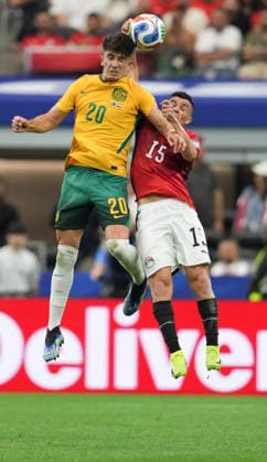 (260704) -- DALLAS, July 4, 2026 -- Cristian Volpato (L) of Australia jumps for a header against Karim Hafez of Egypt during the round of 32 match between Australia and Egypt at the 2026 FIFA World Cup, WM, Weltmeisterschaft, Fussball at Dallas Stadium in Dallas, the United States, July 3, 2026. ) (SP)U.S.-DALLAS-FOOTBALL-FIFA WORLD CUP-ROUND OF 32-AUS VS EGY WuxXiaoling 
