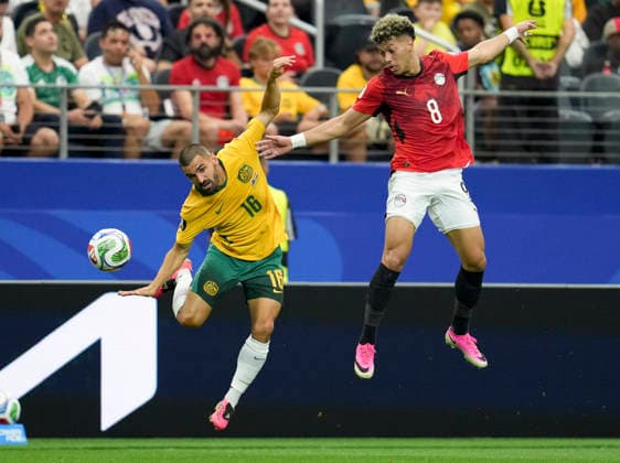 (260704) -- DALLAS, July 4, 2026 -- Aziz Behich (L) of Australia vies with Emam Ashour of Egypt during the round of 32 match between Australia and Egypt at the 2026 FIFA World Cup, WM, Weltmeisterschaft, Fussball at Dallas Stadium in Dallas, the United States, July 3, 2026. ) (SP)U.S.-DALLAS-FOOTBALL-FIFA WORLD CUP-ROUND OF 32-AUS VS EGY WuxXiaoling 