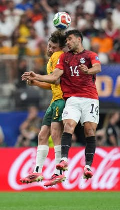 (260704) -- DALLAS, July 4, 2026 -- Connor Metcalfe (L) of Australia jumps for a header against Hamdy Fathy of Egypt during the round of 32 match between Australia and Egypt at the 2026 FIFA World Cup, WM, Weltmeisterschaft, Fussball at Dallas Stadium in Dallas, the United States, July 3, 2026. ) (SP)U.S.-DALLAS-FOOTBALL-FIFA WORLD CUP-ROUND OF 32-AUS VS EGY WuxXiaoling 