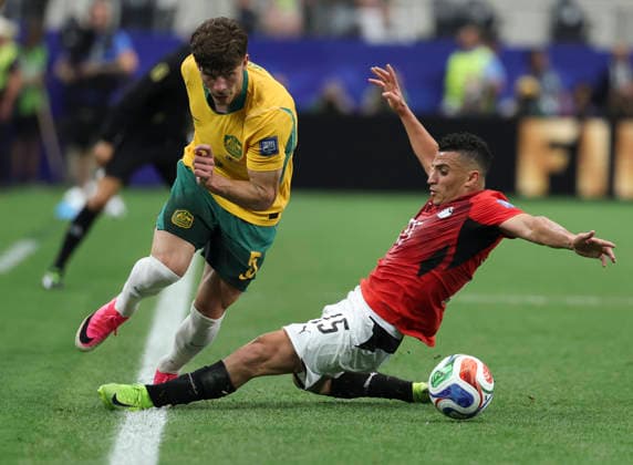 (260704) -- DALLAS, July 4, 2026 -- Karim Hafez (R) of Egypt tackles Jordan Bos of Australia during the round of 32 match between Australia and Egypt at the 2026 FIFA World Cup, WM, Weltmeisterschaft, Fussball at Dallas Stadium in Dallas, the United States, July 3, 2026. ) (SP)U.S.-DALLAS-FOOTBALL-FIFA WORLD CUP-ROUND OF 32-AUS VS EGY LixYing 