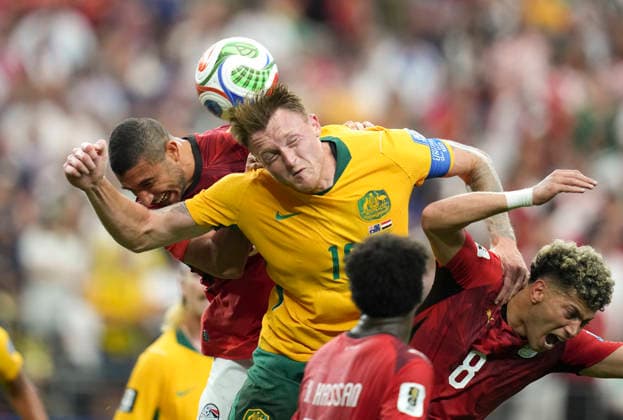 (260704) -- DALLAS, July 4, 2026 -- Harry Souttar (C) of Australia jumps for a header during the round of 32 match between Australia and Egypt at the 2026 FIFA World Cup, WM, Weltmeisterschaft, Fussball at Dallas Stadium in Dallas, the United States, July 3, 2026. ) (SP)U.S.-DALLAS-FOOTBALL-FIFA WORLD CUP-ROUND OF 32-AUS VS EGY WuxXiaoling 