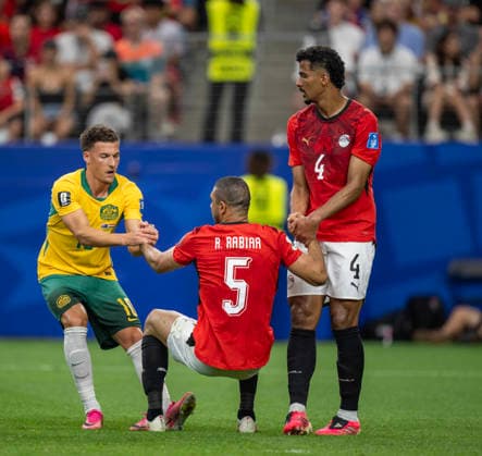 July 3, 2026, Arlington, Texas, USA: Australia player 10 Mid AJDIN HRUSTIC showing good sportsmanship helping Egypt player 5 Def RAMY RABIA and 4 Def HOSSAM ABDELMAGUID on the pitch Arlington USA - ZUMAm147 20260703_zap_m147_033 Copyright: xHossxMcBainx