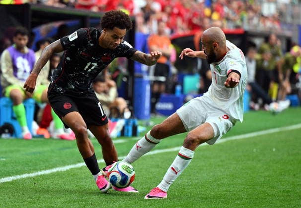 FIFA World Cup, WM, Weltmeisterschaft, Fussball 2026 - Round of 16 - Canada vs Morocco Tajon Buchanan of Canada (L) and Noussair Mazraoui of Morocco in action during the FIFA World Cup 2026 Round of 16 match Canada against Morocco, in Houston, USA, 04 July 2026. HOUSTON United States  Copyright: xSAMxWASSONx