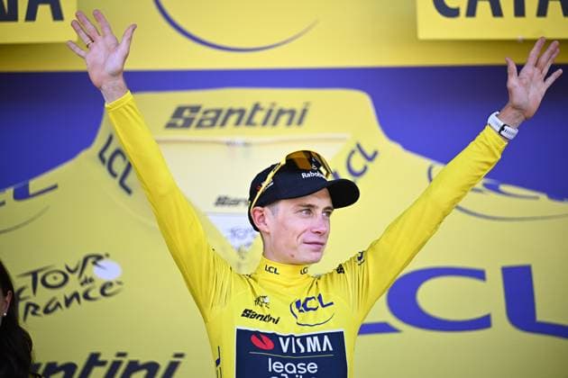 Danish Jonas Vingegaard of Team Visma-Lease a Bike celebrates on the podium in the yellow jersey of leader in the overall ranking after the first stage of the 2026 Tour de France cycling race, a team time trial of 19km with start and finish in Barcelona, Spain, Saturday 04 July 2026. The 113th edition of the Tour de France starts on Saturday 4 July in Barcelona, Spain, and will finish in Paris, France on the 26th of July. JASPERxJACOBS  x180371873x