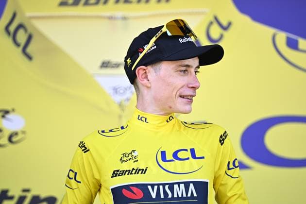 Danish Jonas Vingegaard of Team Visma-Lease a Bike celebrates on the podium in the yellow jersey of leader in the overall ranking after the first stage of the 2026 Tour de France cycling race, a team time trial of 19km with start and finish in Barcelona, Spain, Saturday 04 July 2026. The 113th edition of the Tour de France starts on Saturday 4 July in Barcelona, Spain, and will finish in Paris, France on the 26th of July. JASPERxJACOBS  x180371874x