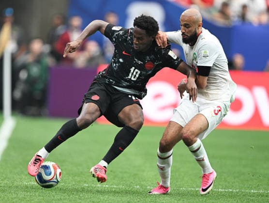 (260705) -- HOUSTON, July 5, 2026 -- Jonathan David (L) of Canada competes with Noussair Mazraoui of Morocco during the round of 16 match between Canada and Morocco at the 2026 FIFA World Cup, WM, Weltmeisterschaft, Fussball at Houston Stadium in Houston, the United States, July 4, 2026. ) (SP)U.S.-HOUSTON-FOOTBALL-FIFA WORLD CUP-ROUND OF 16-CAN VS MAR XiaoxYijiu 