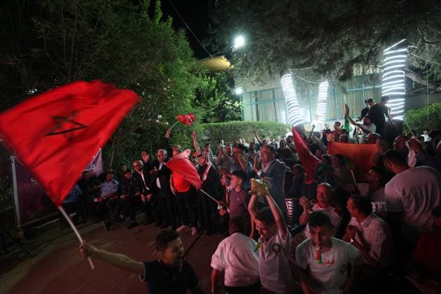 HEBRON, WEST BANK JULY 4, 2026: Palestinians cheer for the Moroccan national team, Nationalteam in the city of Hebron after Morocco defeated Canada 3 0 in the FIFA World Cup, WM, Weltmeisterschaft, Fussball 2026 Round of 16. Supporters gathered to celebrate Morocco™s qualification to the quarterfinals. HEBRON Palestine, State of Copyright: x xMosabxshawerx xJNAxPressx