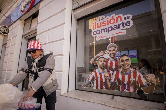 Paraguay football team supporters in Asuncion watch FIFA World Cup, WM, Weltmeisterschaft, Fussball 2026 - Round of 16 ASUNCION, PARAGUAY – JULY 4: A man prepare some drinks in front of a sticker of three Paraguayan national football team players before the start of the game against France at the streets of Downtown Asuncion during the FIFA World Cup Round of 16, in Asuncion, Paraguay, on July 4, 2026. Nathalia Aguilar Anadolu Asuncion Paraguay. Editorial use only. Please get in touch for any other usage.  Copyright: x2026xAnadoluxNathaliaxAguilarx