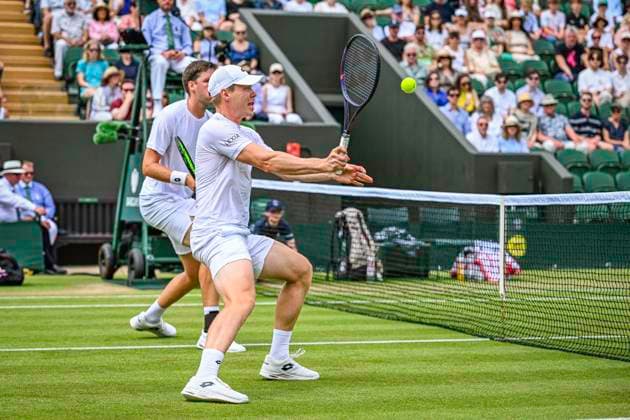 RECORD DATE NOT STATED 5th July 2026; All England Lawn Tennis and Croquet Club, London, England; Wimbledon Tennis Tournament, Day Seven; Harri Heliovaara (FIN) plays a volley in his third round match with Henry Patten (GBR) against Adam Pavlasek (CZE) and Patrik Riki (CZE) GodfreyxPitt