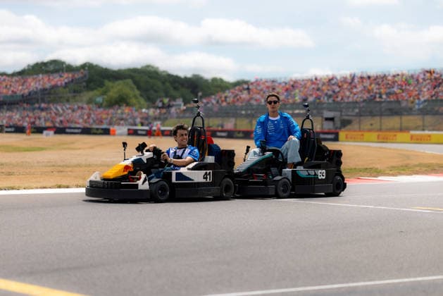 July 5, 2026, Silverstone, Northamptonshire, United Kingdom: ARVID LINDBLAD (41, Visa Cash App Racing Bulls F1 Team, GBR, British F1 Driver, VCARB 03) GEORGE RUSSELL (63, Mercedes AMG Petronas F1 Team, GBR, British F1 Driver, W17) with LEGO Karts during the drivers parade on race day (Sunday) at the Formula 1 Pirelli British Grand Prix 2026 at Silverstone Circuit F12026: British Grand Prix  - ZUMAr193 20260705_zsp_r193_092 Copyright: xSaraxRuffonix