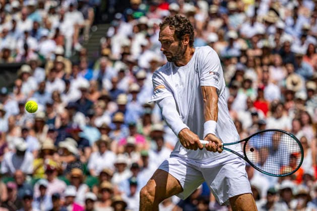 RECORD DATE NOT STATED 5th July 2026; All England Lawn Tennis and Croquet Club, London, England; Wimbledon Tennis Tournament, Day Seven; Roman Safiullin plays a backhand in his forth round match against Novak Djokovic (SRB) GodfreyxPitt