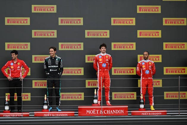 RECORD DATE NOT STATED 5th July 2026; Silverstone Circuit, Northamptonshire, England; FIA Formula 1 2026 British F1 Grand Prix; Race Day; the podium made up of Bryan Bozzi, Charles Leclercs race engineer, George Russell of Mercedes, Charles Leclerc of Ferrari and Lewis Hamilton of Ferrari SimonxWest
