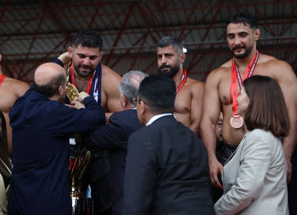Erkan Tas wins chief wrestler title at 665th Historic Kirkpinar Oil Wrestling Festival EDIRNE, TURKIYE - JULY 5: Erkan Tas is presented with his golden belt by Osman Askin Bak, Minister of Youth and Sports, and Bilal Erdogan, President of the World Ethnosport Federation after the 665th Historic Kirkpinar Oil Wrestling Festival at the Sarayici Er Meydani wrestling grounds in Edirne, Turkiye, on July 5, 2026. Ozgun Tiran Anadolu Edirne Turkey. Editorial use only. Please get in touch for any other usage.  Copyright: x2026xAnadoluxOzgunxTiranx