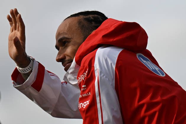 RECORD DATE NOT STATED 5th July 2026; Silverstone Circuit, Northamptonshire, England; FIA Formula 1 2026 British F1 Grand Prix; Race Day; Lewis Hamilton of Ferrari climbs the paddock fence to wave at fans SimonxWest