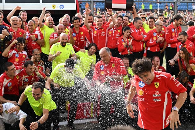 RECORD DATE NOT STATED 5th July 2026; Silverstone Circuit, Northamptonshire, England; FIA Formula 1 2026 British F1 Grand Prix; Race Day; Ferrari team photo after winning first and third place in the British Grand Prix as champagne is sprayed at Charles Leclerc SimonxWest