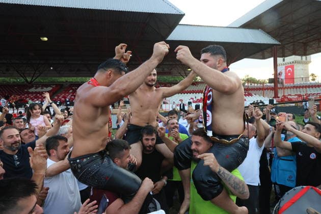 Erkan Tas wins chief wrestler title at 665th Historic Kirkpinar Oil Wrestling Festival EDIRNE, TURKIYE - JULY 5: Erkan Tas celebrates with other wrestlers wearing his golden belt after winning the 665th Historic Kirkpinar Oil Wrestling Festival at the Sarayici Er Meydani wrestling grounds in Edirne, Turkiye, on July 5, 2026. Cihan Demirci Anadolu Edirne Turkey. Editorial use only. Please get in touch for any other usage.  Copyright: x2026xAnadoluxCihanxDemircix