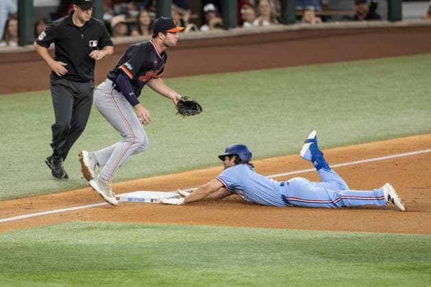 July 5, 2026, Arlington, Texas, USA: Texas Rangers left fielder JOSH SMITH (8) slides safely into third base after hitting a triple during a MLB, Baseball Herren, USA game between the Detroit Tigers and Texas Rangers at Globe Life Field. Tigers win 6-3. MLB 2026: Tigers 6:3 Rangers  - ZUMAf180 20260705_zsp_f180_013 Copyright: xMarkxFannx