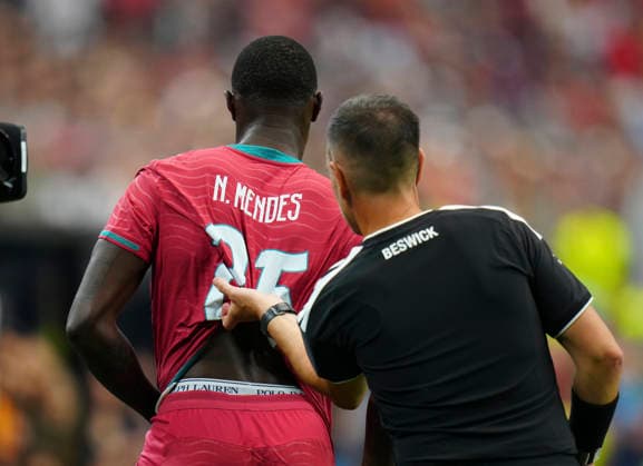 (260707) -- DALLAS, July 7, 2026 -- Nuno Mendes of Portugal changes his jersey during the round of 16 match between Spain and Portugal at the 2026 FIFA World Cup, WM, Weltmeisterschaft, Fussball at Dallas Stadium in Dallas, the United States, July 6, 2026. ) (SP)U.S.-DALLAS-FOOTBALL-FIFA WORLD CUP-ROUND OF 16-ESP VS POR JiaxHaocheng 