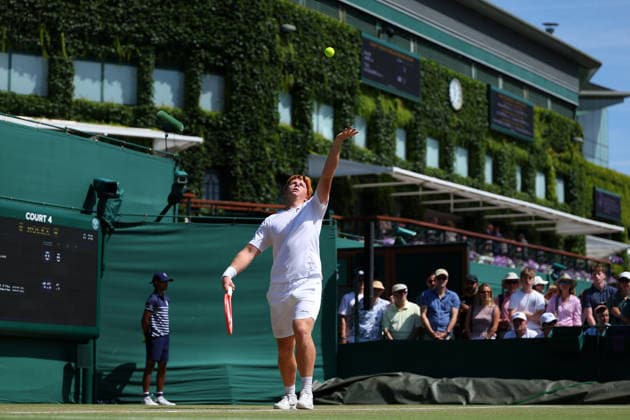 RECORD DATE NOT STATED 7th July 2026; All England Lawn Tennis and Croquet Club, London, England; Wimbledon Tennis Tournament, Day Nine; Jamie Mackenzie (GER) serves to Mark Ceban (GBR) with the backdrop of Centre Court JohnxPatrickxFletcher