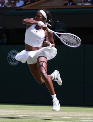 American Coco Gauff plays a forehand in her Quarter-Finals match against American Jessica Pegula on day nine of the 2026 Wimbledon Championships in London on Tuesday, June 07, 2026. Gauff won the match 4-6 6-3 6-3.  LON2026070730 HUGOxPHILPOTT