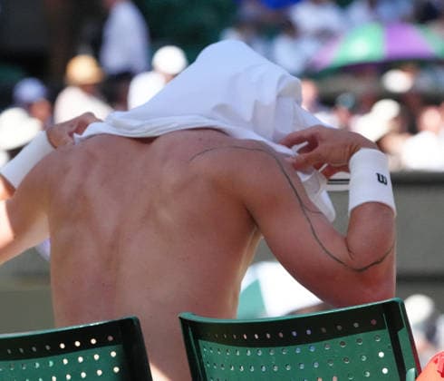 Tennis - 2026 Wimbledon Championships - Day Eight (Week Two) - All England Lawn Tennis & Croquet Club, London - Tuesday 7th July 2026 Center Court : Mens Singles : Jiri Lehecka (CZE) v Alexander Zverev (GER) Jiri Lehecka (CZE) with tattoo line running down his right arm COLORSPORT ANDREW COWIE 