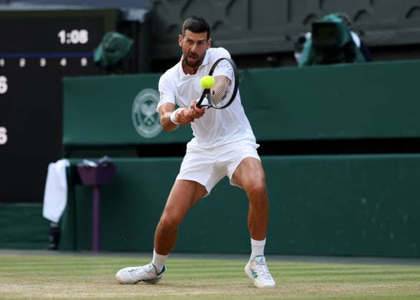 RECORD DATE NOT STATED 7th July 2026; All England Lawn Tennis and Croquet Club, London, England; Wimbledon Tennis Tournament, Day Nine; Novak Djokovic (SRB) with a backhand shot to Feliz Auger-Aliassime (CAN) JohnxPatrickxFletcher
