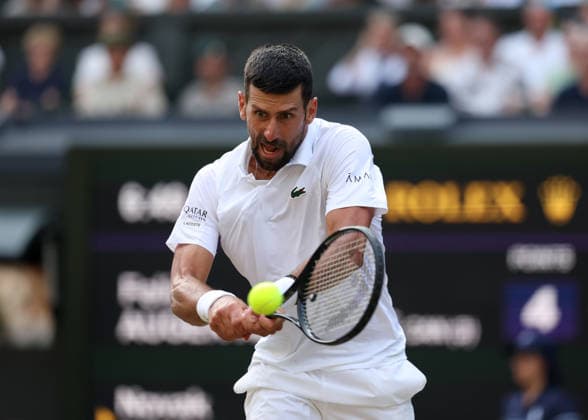 RECORD DATE NOT STATED 7th July 2026; All England Lawn Tennis and Croquet Club, London, England; Wimbledon Tennis Tournament, Day Nine; Novak Djokovic (SRB) with a backhand shot to Feliz Auger-Aliassime (CAN) JohnxPatrickxFletcher