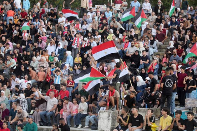 July 7, 2026, Nablus, Palestine: Palestinians wave Palestinian and Egyptian flags while watching the World Cup match between Egypt and Argentina. Palestinian fans seen at Jamal Abdel Nasser Stadium, watching the match via live World Cup broadcast big screen tv. Final scores; Argentina 3 : 2 Egypt. Nablus Palestine - ZUMAs197 20260707_aaa_s197_058 Copyright: xNasserxIshtayehx