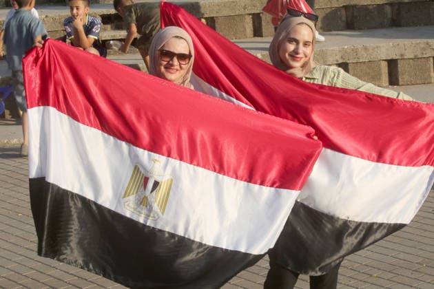 July 7, 2026, Nablus, Palestine: Palestinian ladies hold the Egyptian flags while watching the World Cup match between Egypt and Argentina. Palestinian fans seen at Jamal Abdel Nasser Stadium, watching the match via live World Cup broadcast big screen tv. Final scores; Argentina 3 : 2 Egypt. Nablus Palestine - ZUMAs197 20260707_aaa_s197_061 Copyright: xNasserxIshtayehx
