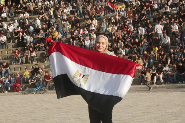 July 7, 2026, Nablus, Palestine: A Palestinian lady holds an Egyptian flag while watching the World Cup match between Egypt and Argentina. Palestinian fans seen at Jamal Abdel Nasser Stadium, watching the match via live World Cup broadcast big screen tv. Final scores; Argentina 3 : 2 Egypt. Nablus Palestine - ZUMAs197 20260707_aaa_s197_059 Copyright: xNasserxIshtayehx