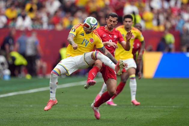 July 7, 2026, Vancouver, Bc, CANADA: Colombia s Gustavo Puerta (14) and Switzerland s Remo Freuler (8) vie for the ball during the first half of a World Cup Round of 16 soccer match, in Vancouver, on Tuesday, July 7, 2026. Canada News - July 7, 2026  - ZUMAc35_ 20260707_zaf_c35_177 Copyright: xDarrylxDyckx