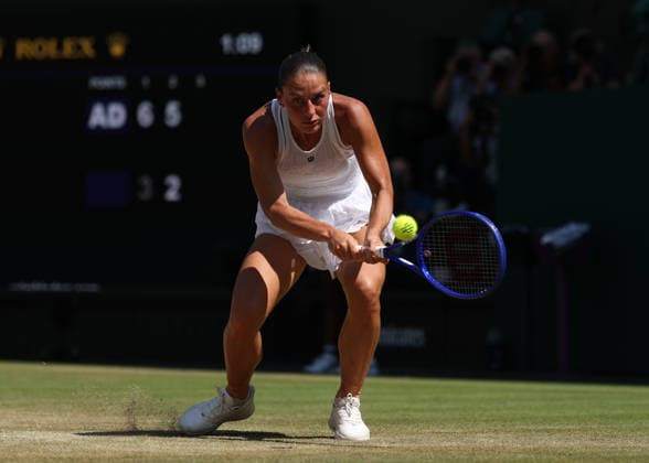 RECORD DATE NOT STATED 8th July 2026; All England Lawn Tennis and Croquet Club, London, England; Wimbledon Tennis Tournament, Day Ten; Marta Kostyuk (UKR) with a backhand shot to Jasmine Paolini (ITA) JohnxPatrickxFletcher