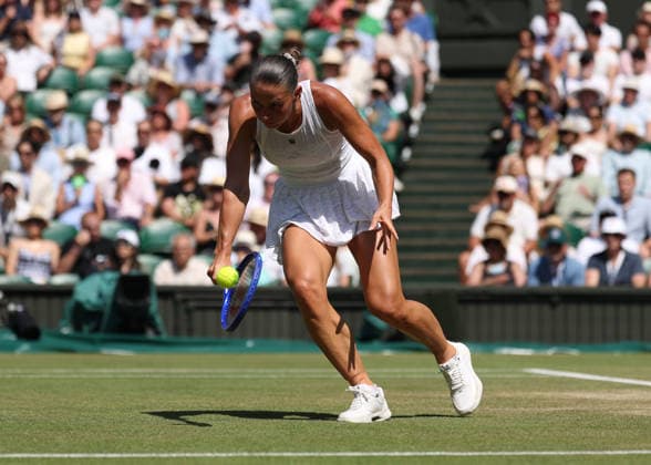 RECORD DATE NOT STATED 8th July 2026; All England Lawn Tennis and Croquet Club, London, England; Wimbledon Tennis Tournament, Day Ten; Marta Kostyuk (UKR) with a backhand shot to Jasmine Paolini (ITA) JohnxPatrickxFletcher