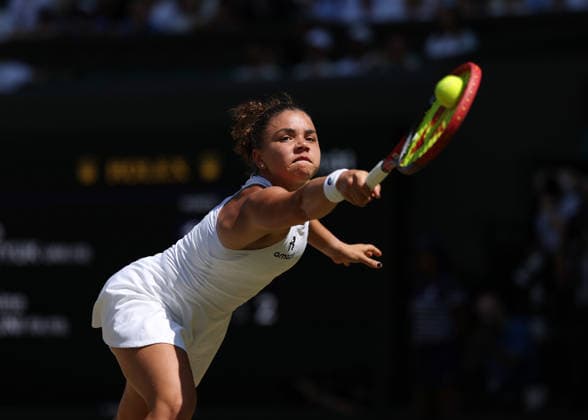 RECORD DATE NOT STATED 8th July 2026; All England Lawn Tennis and Croquet Club, London, England; Wimbledon Tennis Tournament, Day Ten; Jasmine Paolini (ITA) with a backhand shot to Marta Kostyuk (UKR) JohnxPatrickxFletcher