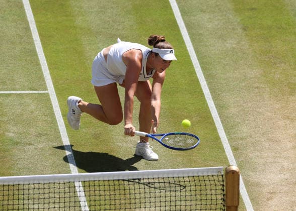 RECORD DATE NOT STATED 8th July 2026; All England Lawn Tennis and Croquet Club, London, England; Wimbledon Tennis Tournament, Day Ten; Linda Noskova (CZE) plays a shot at the net against Elise Mertens (BEL) JohnxPatrickxFletcher