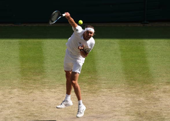 RECORD DATE NOT STATED 8th July 2026; All England Lawn Tennis and Croquet Club, London, England; Wimbledon Tennis Tournament, Day Ten; Alexander Zverev (GER) serves to Taylor Fritz (USA) JohnxPatrickxFletcher