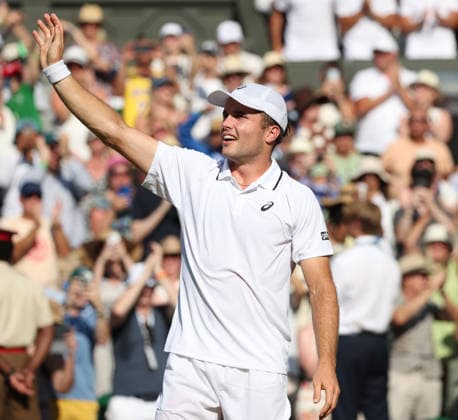 Great Britain s Arthur Fery falls over after victory in his Men s Quarter-Finals match against Italy s Flavio Cobolli on day Ten of the 2026 Wimbledon Championships in London on Wednesday, July 08,2026.  LON2026070855 HUGOxPHILPOTT