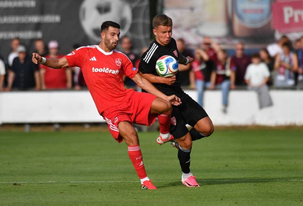 08.07.2026 - Fussball - Saison 2026 2027 - Testspiel Freundschaftsspiel Vorbereitungsspiel: TSV Kornburg - 1. FC Nürnberg Nuernberg FCN ( Club ) - Sportfoto Zink OGo - xolxgox - Alexios Kalogeropoulos (4, 1. FC Nürnberg FCN ) Jakub Mintal (11, TSV Kornburg ) *** July 8, 2026 Soccer Season 2026–2027 Exhibition Match Friendly Match Preseason Match TSV Kornburg 1 FC Nuremberg Nuremberg FCN Club Sports Photo Zink OGo xolxgox Alexios Kalogeropoulos 4, 1 FC Nuremberg FCN Jakub Mintal 11, TSV Kornburg