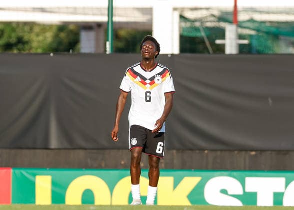Wrexham, Wales, 8th July 2026. Boris Mamuzah Lum of Germany reacts after his side concedes their first goal during the Ukraine U19 vs Germany U19 UEFA European U19 Championship match at The Racecourse, Wrexham. Picture credit should read: Cody Froggatt Sportimage EDITORIAL USE ONLY. No use with unauthorised audio, video, data, fixture lists, club league logos or live services. Online in-match use limited to 120 images, no video emulation. No use in betting, games or single club league player publications. SPI_023_CF_UKRAINE_U19_V_GERMANY_U19 SPI-4857-0022