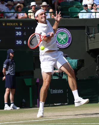 American Taylor Fritz plays a forehand in his Men s Quarter-Finals match against Germany s Alexander Zverev on day Ten of the 2026 Wimbledon Championships in London on Wednesday, July 08,2026. Zverev won the match 6-4 6-4 6-2.  LON20260708100 HUGOxPHILPOTT