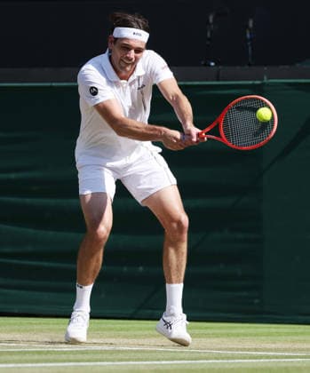 American Taylor Fritz plays a backhand in his Men s Quarter-Finals match against Germany s Alexander Zverev on day Ten of the 2026 Wimbledon Championships in London on Wednesday, July 08,2026. Zverev won the match 6-4 6-4 6-2.  LON20260708106 HUGOxPHILPOTT