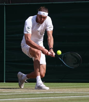 Germany s Alexander Zverev plays a backhand in his Men s Quarter-Finals match against American Taylor Fritz on day Ten of the 2026 Wimbledon Championships in London on Wednesday, July 08,2026. Zverev won the match 6-4 6-4 6-2.  LON2026070895 HUGOxPHILPOTT