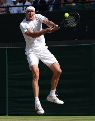 Germany s Alexander Zverev plays a backhand in his Men s Quarter-Finals match against American Taylor Fritz on day Ten of the 2026 Wimbledon Championships in London on Wednesday, July 08,2026. Zverev won the match 6-4 6-4 6-2.  LON2026070898 HUGOxPHILPOTT