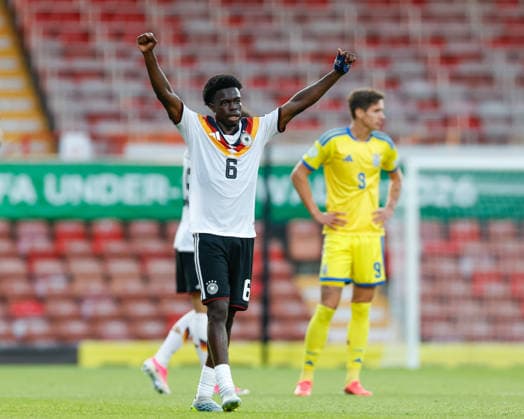 Wrexham, Wales, 8th July 2026. Boris Mamuzah Lum of Germany celebrates the full time result as Germany qualify for the the UEFA European U19 Championship final following the Ukraine U19 vs Germany U19 UEFA European U19 Championship match at The Racecourse, Wrexham. Picture credit should read: Cody Froggatt Sportimage EDITORIAL USE ONLY. No use with unauthorised audio, video, data, fixture lists, club league logos or live services. Online in-match use limited to 120 images, no video emulation. No use in betting, games or single club league player publications. SPI_046_CF_UKRAINE_U19_V_GERMANY_U19 SPI-4857-0045