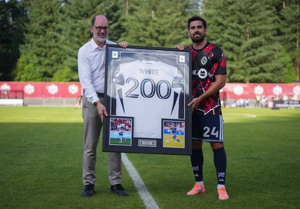 July 8, 2026, Burnaby, Bc, CANADA: Vancouver Whitecaps CEO Axel Schuster, left, presents Brian White with a framed jersey to mark his 200th match across all competitions, before a Canadian Championship quarterfinal soccer match against Cavalry FC, in Burnaby, B.C., on Wednesday, July 8, 2026. Canada News - July 8, 2026  - ZUMAc35_ 20260708_zaf_c35_072 Copyright: xDarrylxDyckx