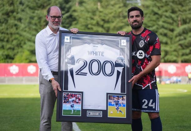 July 8, 2026, Burnaby, Bc, CANADA: Vancouver Whitecaps CEO Axel Schuster, left, presents Brian White with a framed jersey to mark his 200th match across all competitions, before a Canadian Championship quarterfinal soccer match against Cavalry FC, in Burnaby, B.C., on Wednesday, July 8, 2026. Canada News - July 8, 2026  - ZUMAc35_ 20260708_zaf_c35_073 Copyright: xDarrylxDyckx