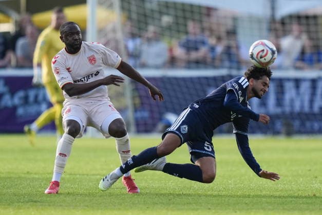 July 8, 2026, Burnaby, Bc, CANADA: Vancouver Whitecaps Jeevan Badwal, right, is upended by Cavalry FC s Bradley Kamdem during the first half of a Canadian Championship quarterfinal soccer match, in Burnaby, B.C., on Wednesday, July 8, 2026. Canada News - July 8, 2026  - ZUMAc35_ 20260708_zaf_c35_083 Copyright: xDarrylxDyckx