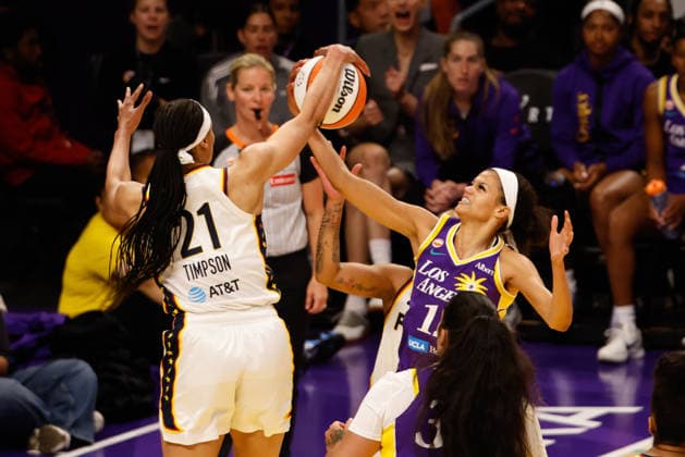 LOS ANGELES, CA - JULY 8: Los Angeles Sparks guard Rae Burrell (12) gets held up by Indiana Fever forward Makayla Timpson (21) during the Indiana Fever at Los Angeles Sparks WNBA, Basketball Damen, USA game on July 08, 2026, at Crypto.com Arena in Los Angeles, CA. (Photo by Jevone Moore Icon Sportswire) WNBA: JUL 08 Indiana Fever at Los Angeles Sparks EDITORIAL USE ONLY Icon20260708028